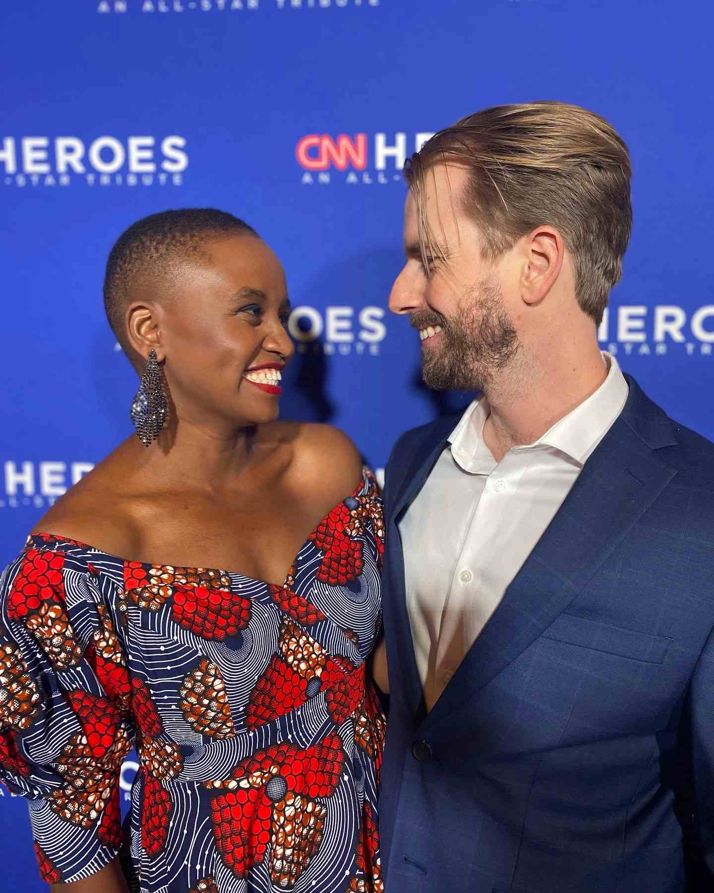 Nelly Cheboi and Tyler cinnamon looking at each other at CNN Heroes red carpet