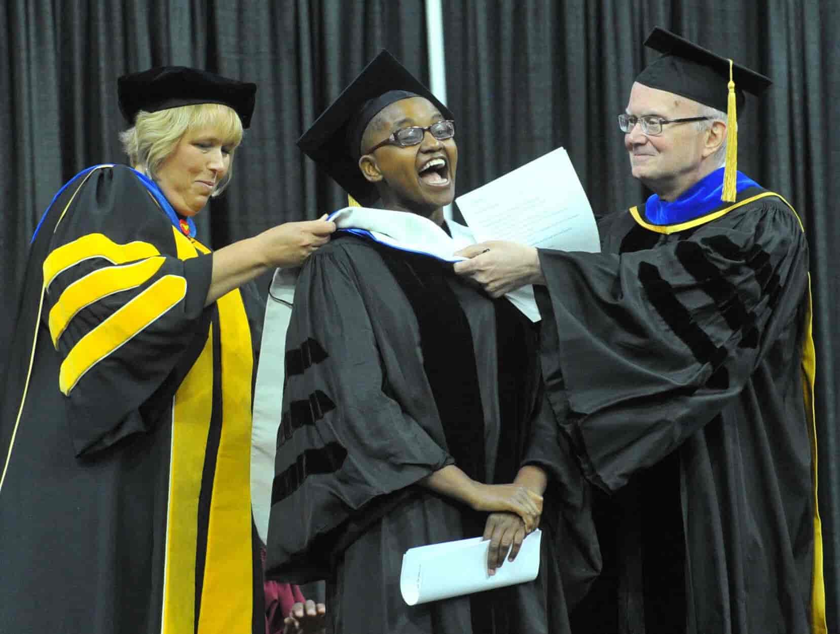 Nelly Cheboi with Dr Bengston and Wendy getting her honorary doctorate stole