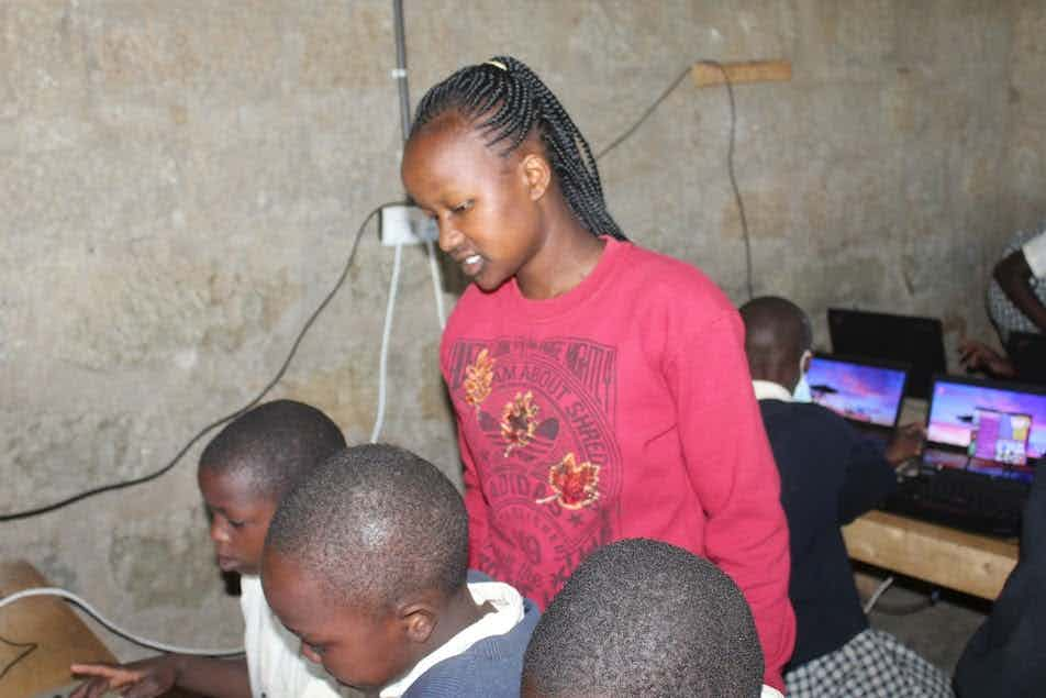 Lucy Koi teaching computer classes at Saint Mary's in Mogotio