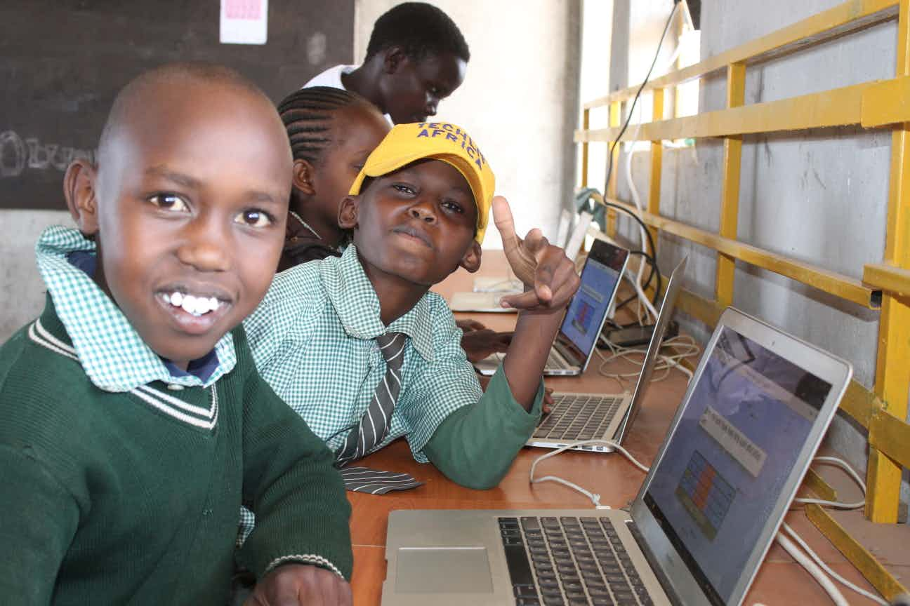 Kids in Zawadi Yetu goofing around in TechLit class