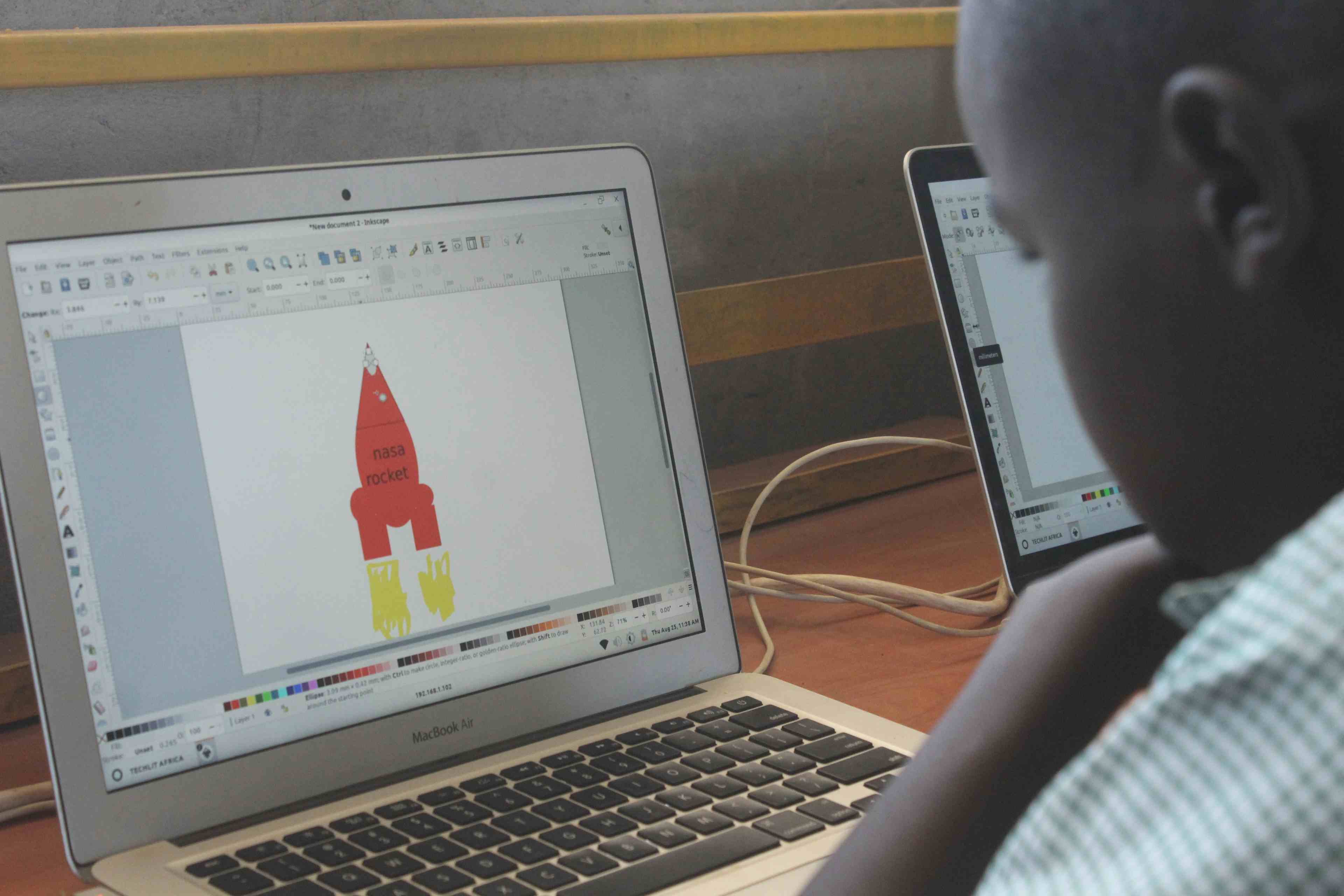 Allan drawing a rocket at the TechLit computer lab zawadi yetu