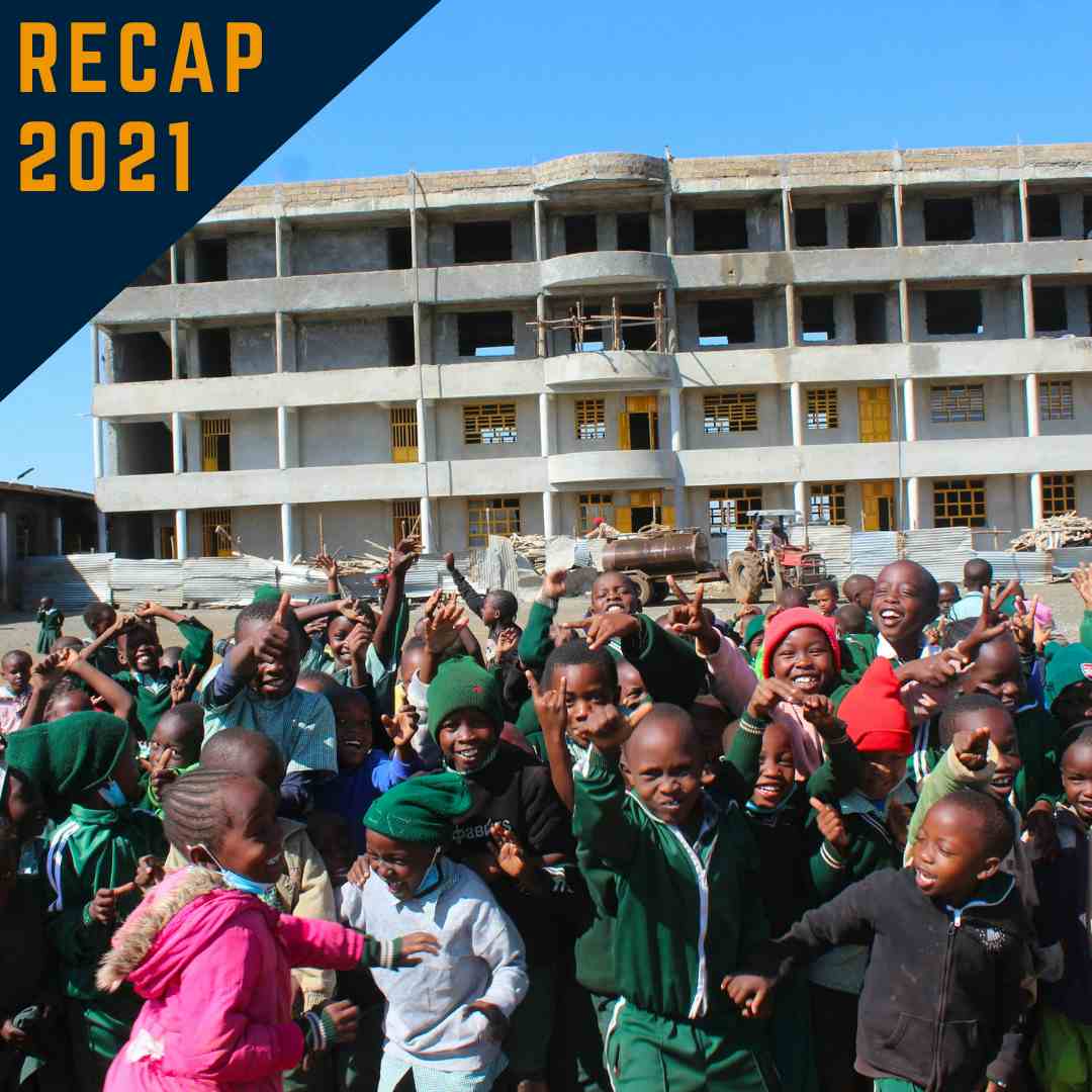 Zawadi Preparatory Students in front of four-floor Zawadi Yetu building